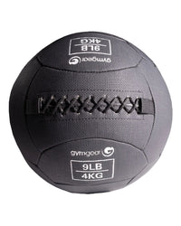 Gym Gear wall balls in 4kg, textured surface for fitness workouts, suitable for strength training and functional exercise.