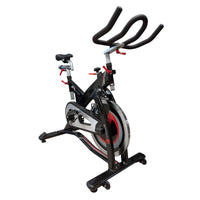 M Sport indoor studio exercise bike with adjustable seat and handlebars, designed for indoor cycling workouts.