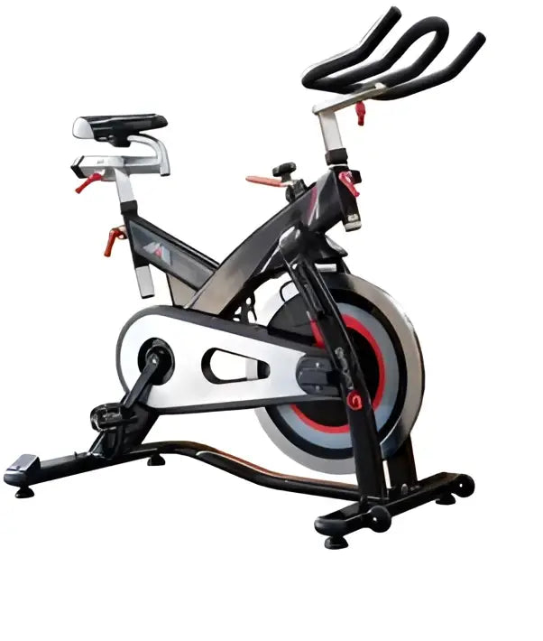 M Sport indoor studio exercise bike with adjustable seat and handlebars, black frame, and digital display for indoor cycling workouts.