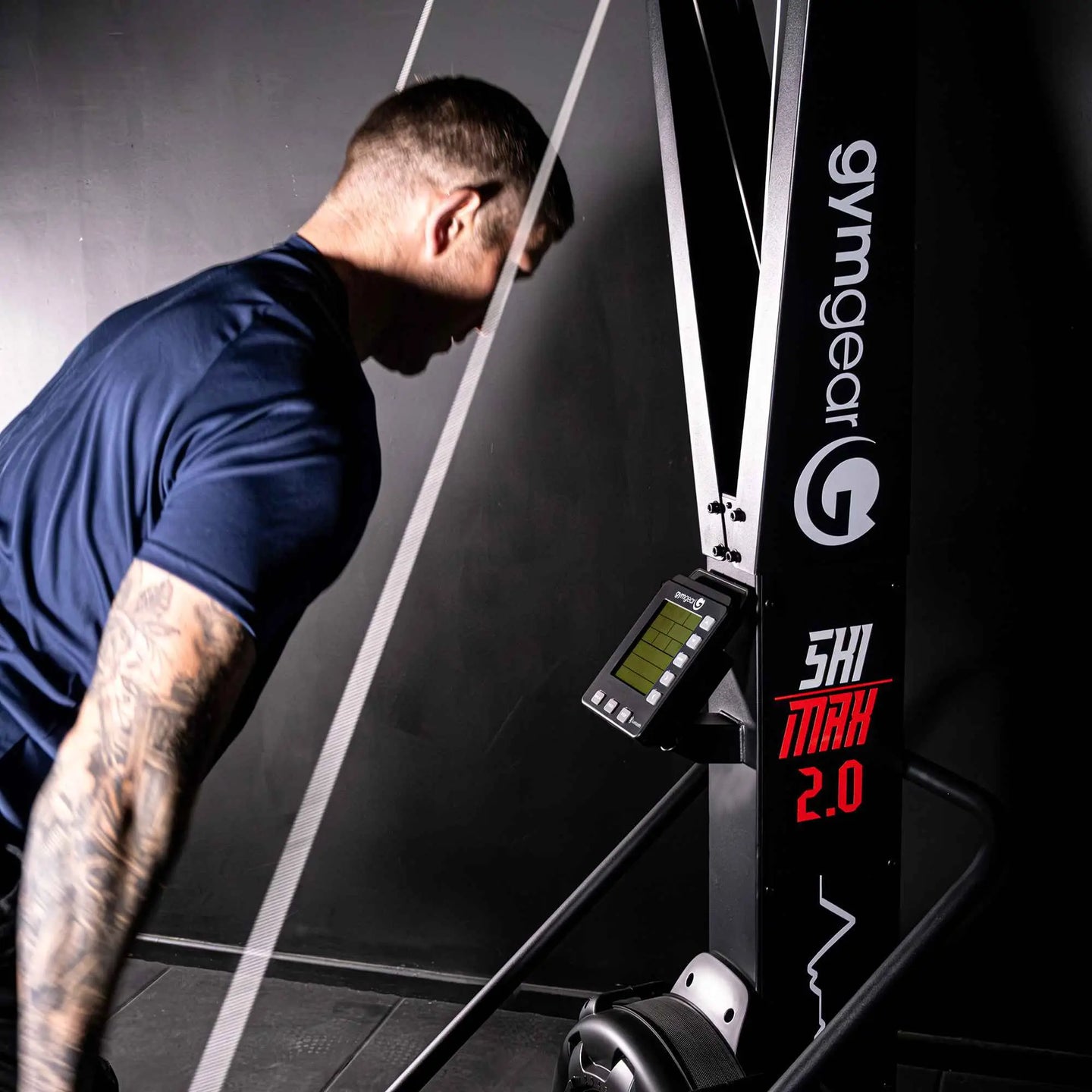 Gym Gear Ski Max 2.0 cardio machine, featuring handles and foot pedals, designed for full-body aerobic workouts.